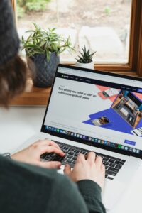 Person shopping online on a laptop using browser tools to find deals