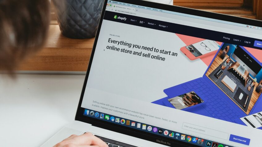 Person shopping online on a laptop using browser tools to find deals