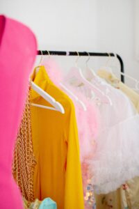 Vibrant garments on a clothes rack showcasing diverse styles and colors
