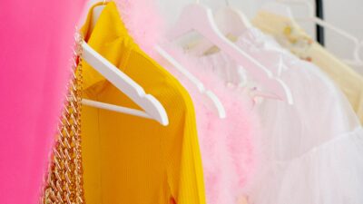 Vibrant garments on a clothes rack showcasing diverse styles and colors