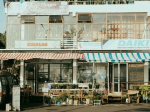Charming street scene featuring local shops with colorful striped awnings