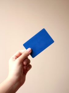 Person holding a store loyalty rewards card