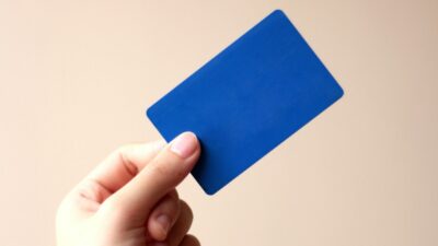 Person holding a store loyalty rewards card