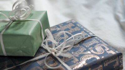 Elegant small gift boxes wrapped in paper with ribbons, all under $25
