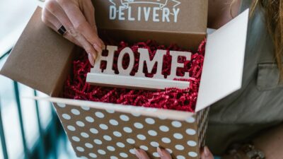 Woman opening a polka dot subscription box labeled Special Delivery